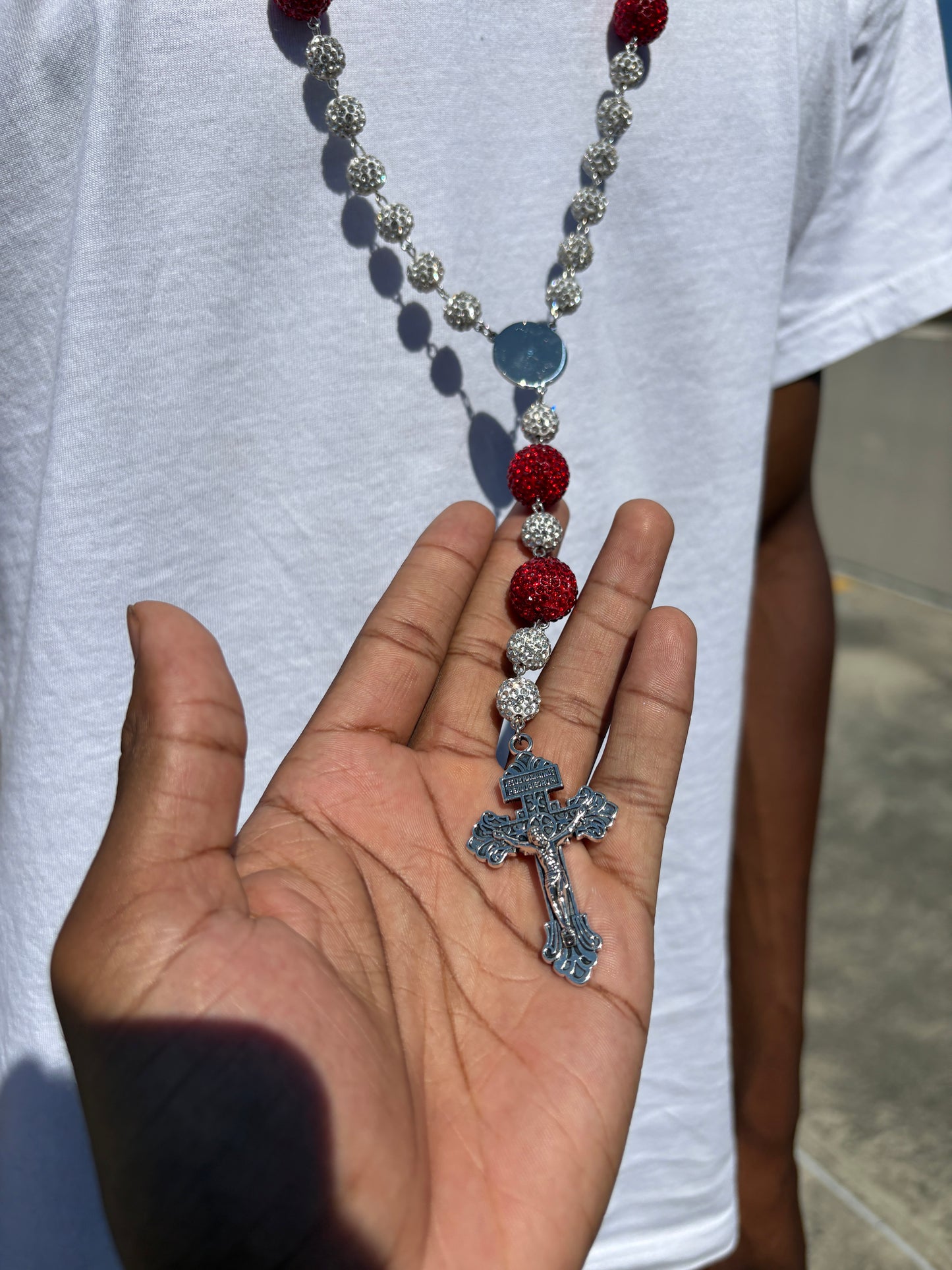 silver and red rosary