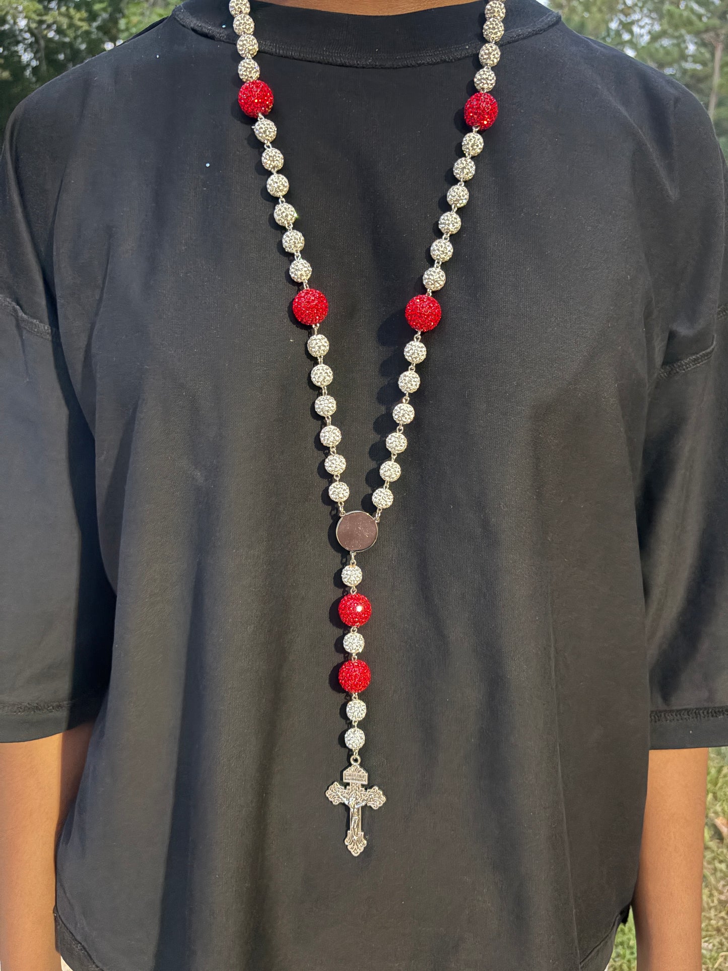 silver and red rosary