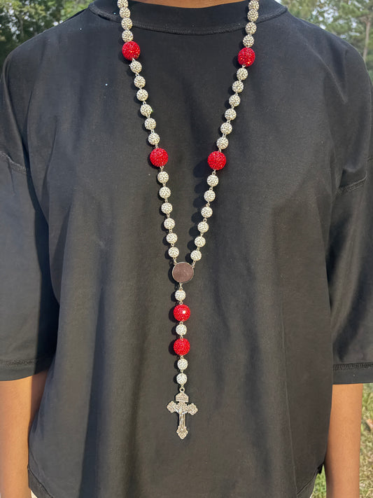 silver and red rosary